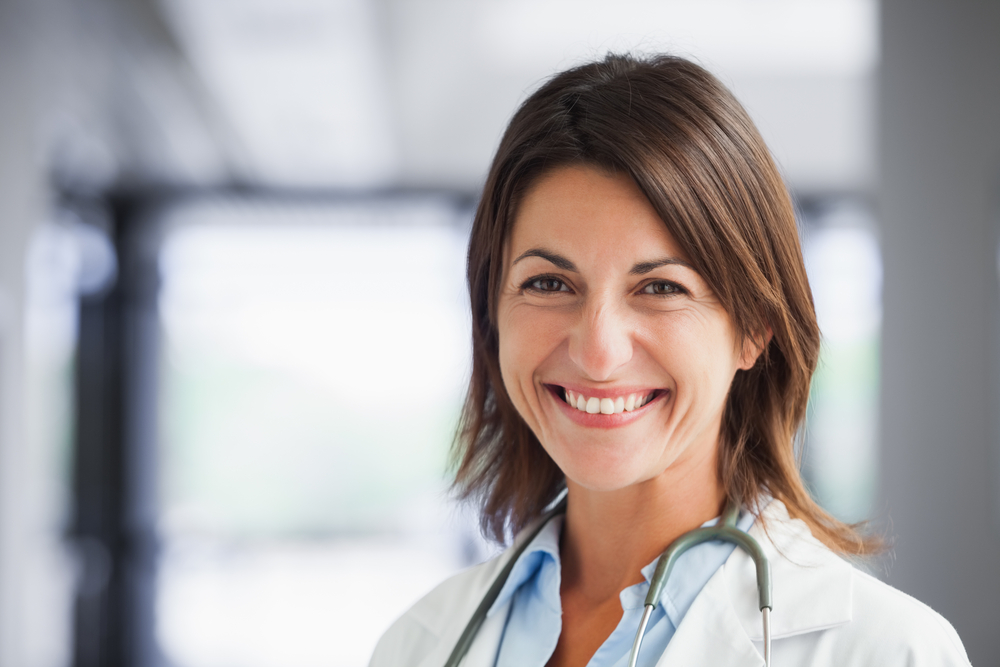 smiling woman with stethoscope